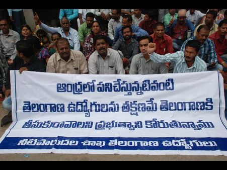 దిగి రావాల్సిందే.. పెట్రోల్ బాటిళ్లతో ఆందోళన, కేటీఆర్ హామీ (పిక్చర్స్)