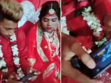 పెళ్లిపీటలపై కూడా అదే పని.. బిత్తరపోయిన వధువు (వీడియో)