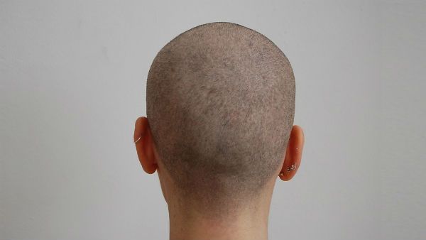 అత్యాచారం కేసులో గ్రామ పెద్దల పైశాచికత్వం.. బాధితురాలికే గుండు గీయించిన వైనం..!