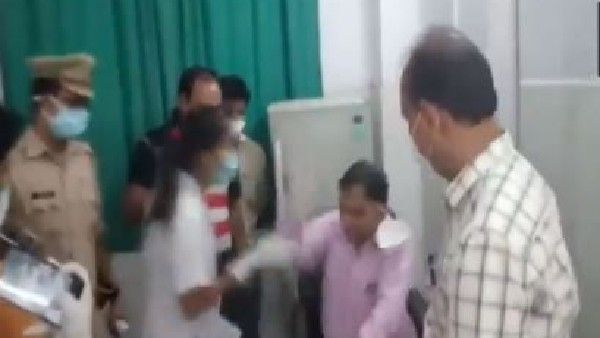 కరోనా స్ట్రెస్: వైద్యుడి చెంప ఛెళ్లుమనిపించిన నర్సు, తిట్లు, కొట్లాట(వీడియో)