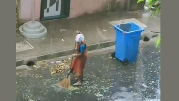 శభాష్ ఉమెన్ వర్కర్.. జోరు వానలో విధి నిర్వహణ.. నెటిజన్ల ప్రశంసలు, ఆనంద్ మహీంద్ర కూడా