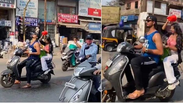 Viral Video: రద్దీ రహదారిపై స్కూటీపై వెళుతూనే స్నానం చేసిన యువతీయువకుడు