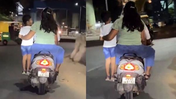 వీళ్లు తల్లిదండ్రులేనా?: కొడుకుని బైక్ ఫుట్‌రెస్ట్‌పై నిల్చొబెట్టి.. (వీడియో)
