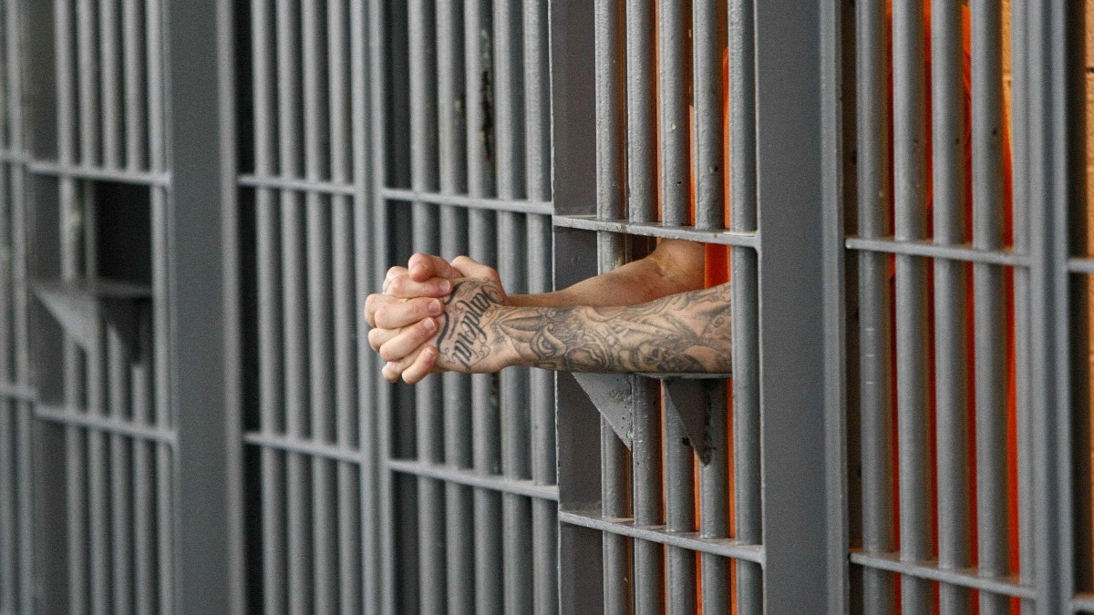 Why are prisoners wearing white clothes 