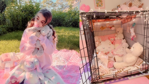 Girl sleeps in a dog crate Girl sleeps in a dog crate