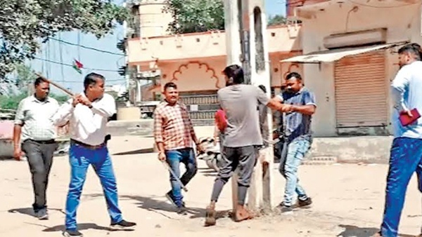 caning Muslim men in Kheda