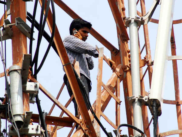 Man on mobile tower Man on mobile tower