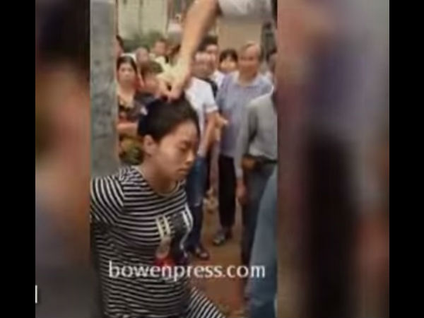 Pregnant woman is tied to a pole and brutally beaten until unconscious Pregnant woman is tied to a pole and brutally beaten until unconscious