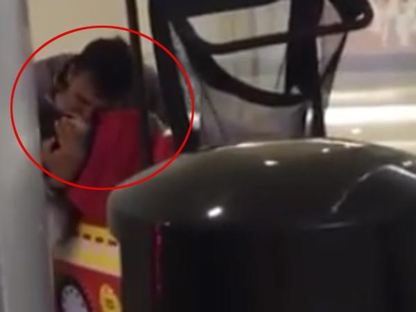 Toy car operator forcefully kisses a child Toy car operator forcefully kisses a child
