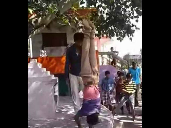 Boy hung upside down, beaten with stick as punishment Boy hung upside down, beaten with stick as punishment