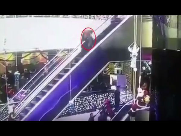 Woman trips over her outfit on an escalator and drops her baby 40ft to its death at a shopping centre Woman trips over her outfit on an escalator and drops her baby 40ft to its death at a shopping centre