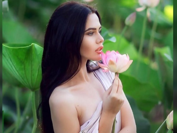 Model Poses With Rare Flower Model Poses With Rare Flower