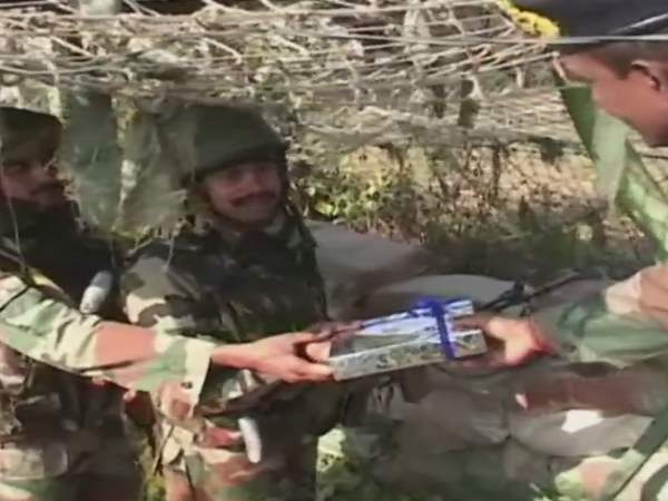 People and army on border celebrating Diwali pics