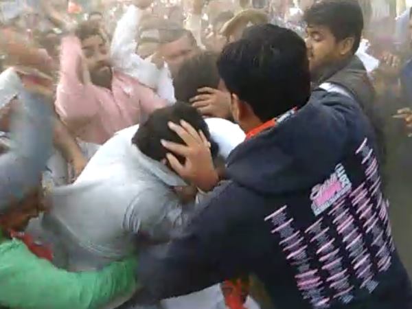 A youth beaten by BJP members when he shown black flag to CM Yogi Adityanath.