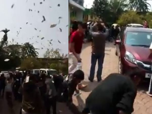 नोट उठाने के लिए लगी लोगों की होड़