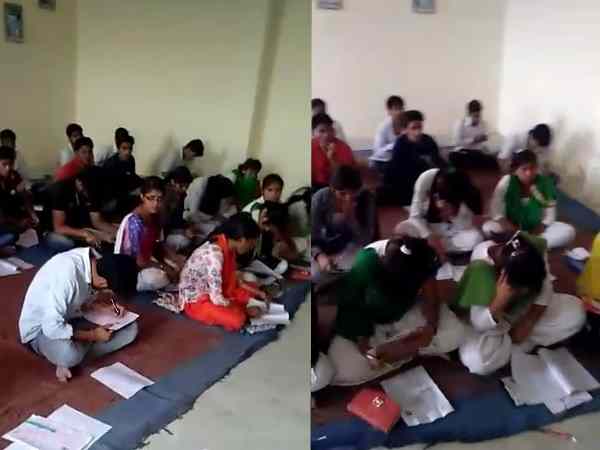 Examiner was walking in the examination room of revolver at Agra University