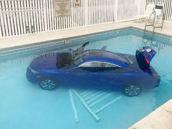 Woman forgets to park car properly; it rolls back and falls in a pool Woman forgets to park car properly; it rolls back and falls in a pool
