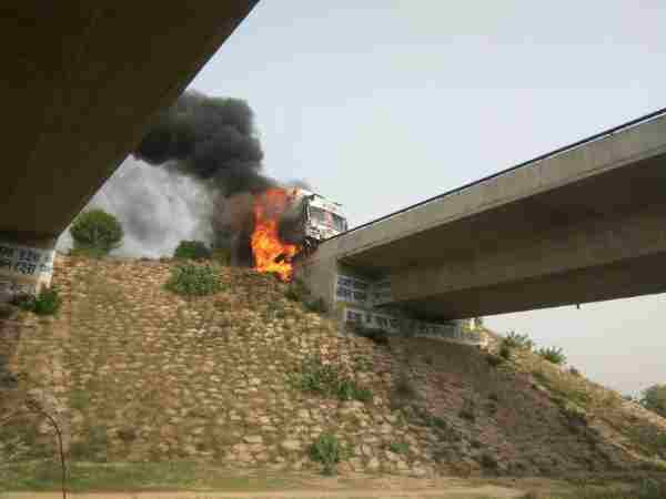 Photos of truck burning on highway in Allahabad