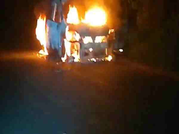 car catch fire on road