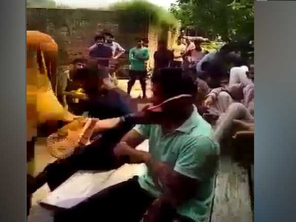 soilder wife beat two boys with slippers in front of panchayat