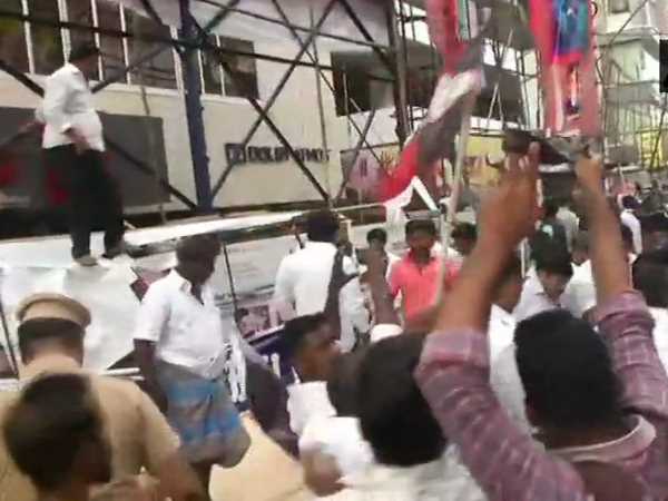 AIADMK workers vandalise posters of Sarkar movie outside Kasi theatre in Chennai 
