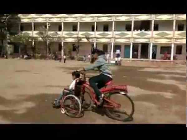 sister joint wheelchair with cycle for his handicap brother in maharashtra