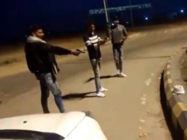 A man shoots birthday cake Video Viral on Social Media Written Gujjar On cake A man shoots birthday cake Video Viral on Social Media Written Gujjar On cake