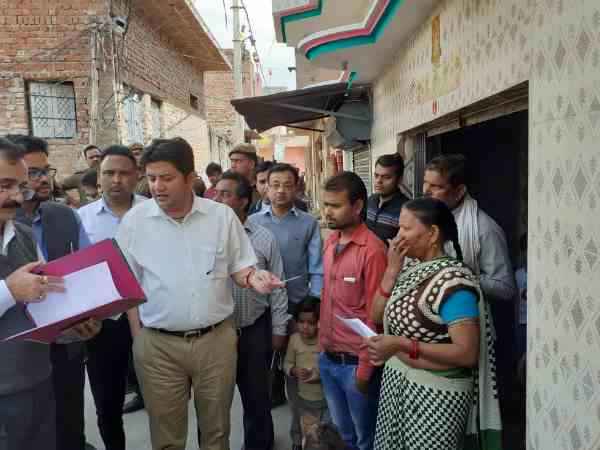 collector giving invitation to the locals to cast their vote