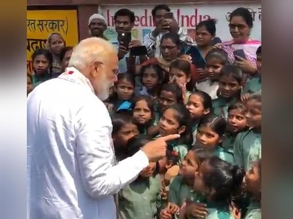 pm narendra modi listen patriotic song from students in varanasi pm narendra modi listen patriotic song from students in varanasi