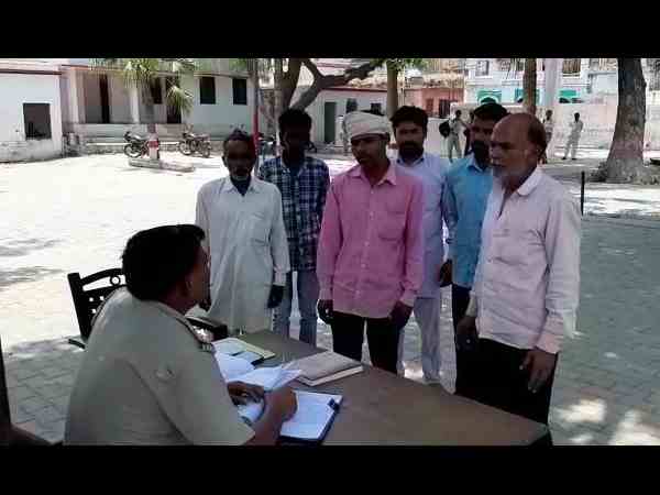hooligans beating and threatening villagers