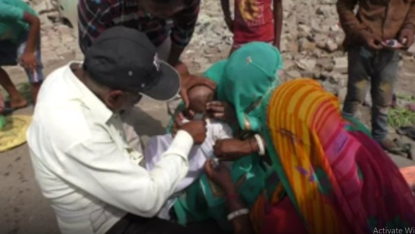 blind faith : Cock protect children from ghosts and diseases in Bharatpur