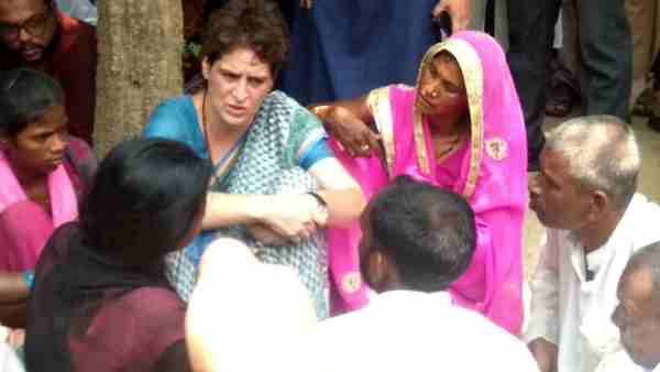 pictures of Priyanka Gandhi weeping during Sonbhadra victims family meeting