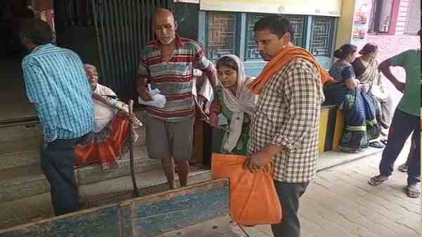 old man peddles cycle rickshaw carrying her wife for treatment