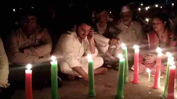 Abdullah Azam sitting on the protest outside the gate of Jauhar University