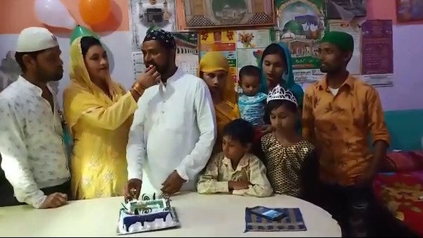 This muslim family celebrate eco friendly bakrid by cutting cakes