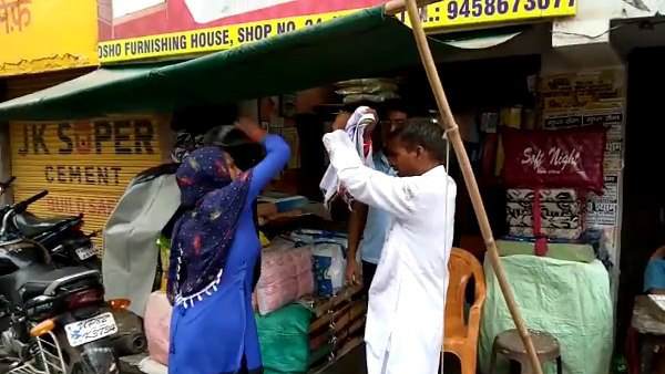 woman beats a man with her slippers