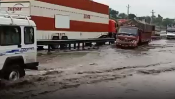 Bus stuck in kurabad underpass, children saved life by climbing on roof