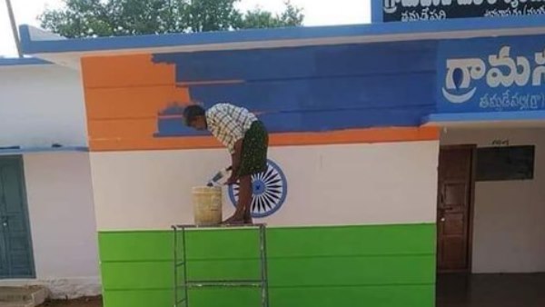 tricoloured building being repainted with colours resembling YSR Congress partys flag colour tricoloured building being repainted with colours resembling YSR Congress partys flag colour