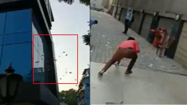 Bundles of currency notes were thrown from a building in Kolkata during a search by DRI officials Bundles of currency notes were thrown from a building in Kolkata during a search by DRI officials