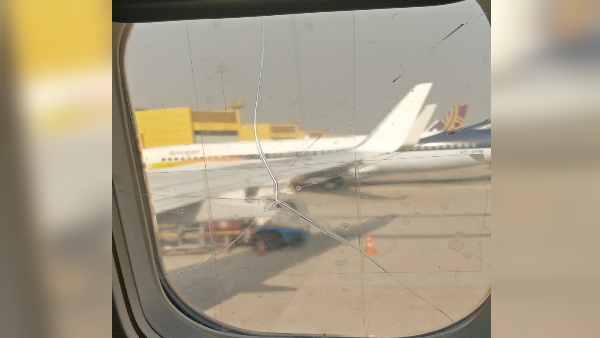 SpiceJet aircraft running with Broken window cello tape SpiceJet aircraft running with Broken window cello tape
