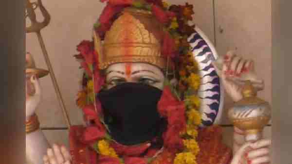 People wear masks to save God from air pollution People wear masks to save God from air pollution