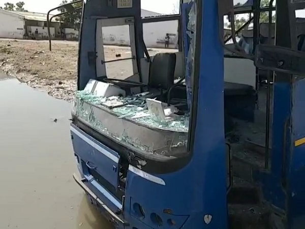 Watch video: migrant workers violence at jamnagar, break bus glass and door