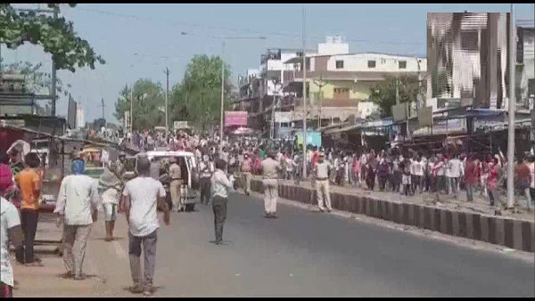 crowd of Migrant workers staged protest at Hazira industrial area in Surat, 55-60 were arrested by Police
