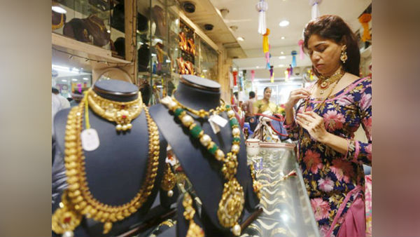  क्यों गिरा सोने का भाव