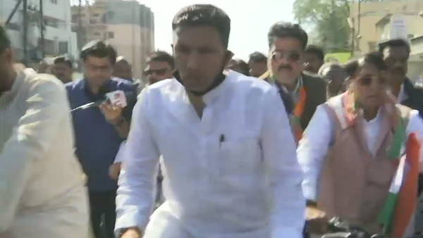 Congress MLAs ride bicycle to Legislative Assembly, in protest against the rising fuel prices