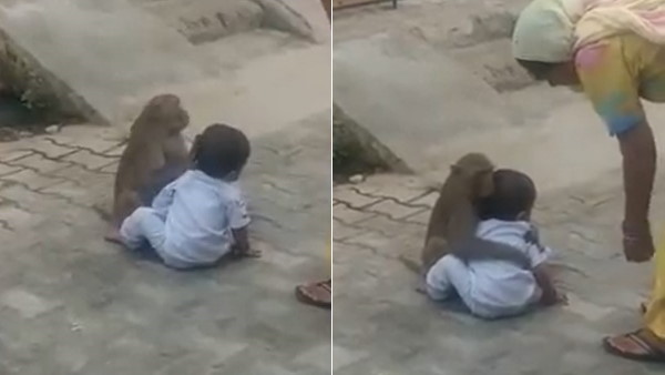 बच्चे को गले से लगाकर लुटा रहा प्यार
