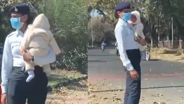 बच्चे के साथ ड्यूटी करती महिला का वीडियो वायरल