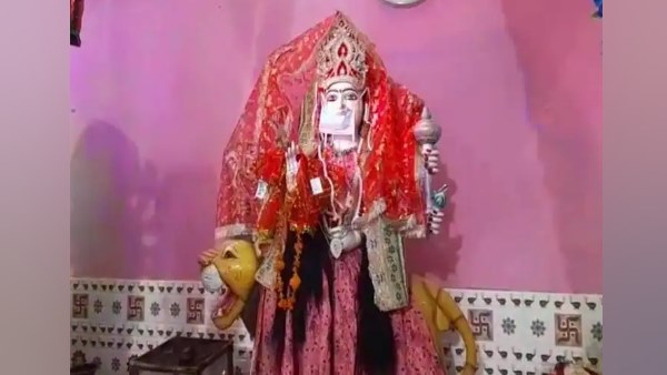 covid 19 Face mask on maa durga idol in temple of Etah for awareness covid 19 Face mask on maa durga idol in temple of Etah for awareness
