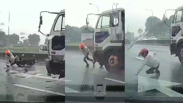 बारिश के कारण फिसल गई मोटरसाइकिल