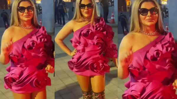 फूशिया पिंक कलर की रफ्ल्ड ड्रेस में थीं राखी